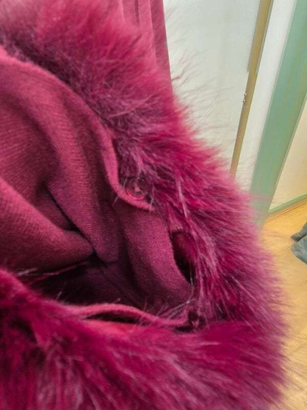 Burgandy zip-up cape jacket with faux fur cuffs