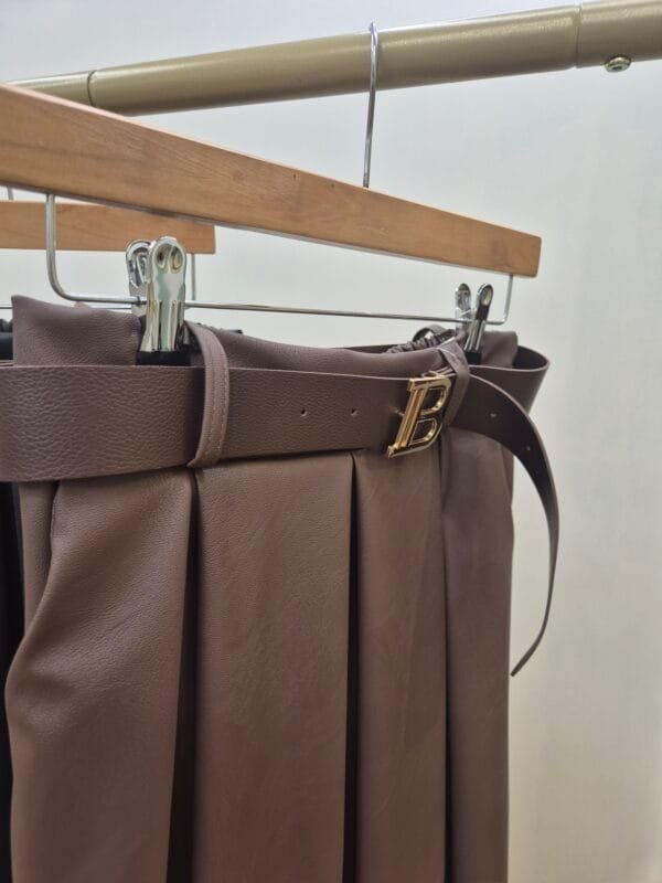 2026/01/1000387941-scaled.jpg Brown Faux Leather Midi Skirt