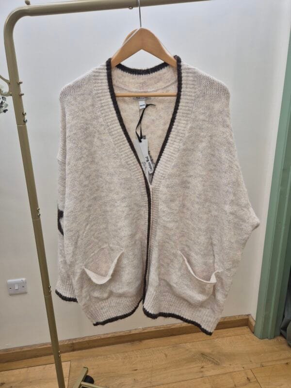 2026/01/1000387952-scaled.jpg Soft Cream Star Relaxed Knit Cardigan