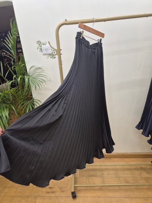 2026/01/1000388869-scaled.jpg Black Satin Pleated Midi Skirt