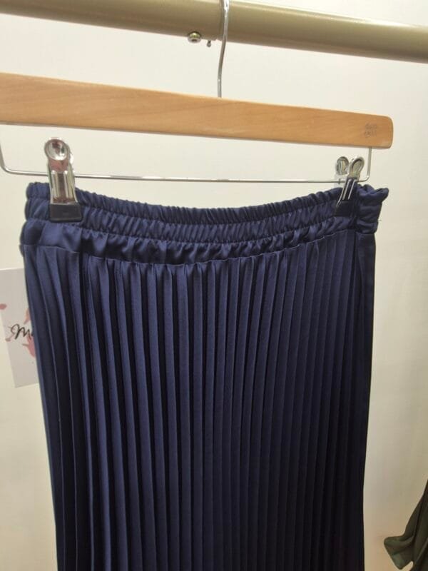 2026/01/1000388877-scaled.jpg Navy Blue Satin Pleated Midi Skirt