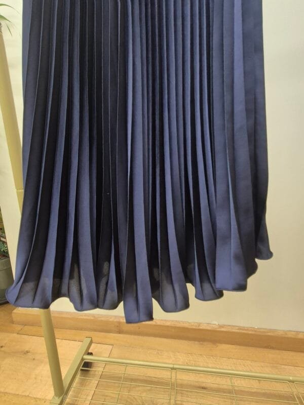 2026/01/1000388881-scaled.jpg Navy Blue Satin Pleated Midi Skirt