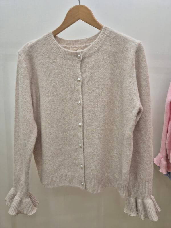 2026/01/1000388987-scaled.jpg Soft Cream Cardigan With Fluted Ruffle Cuffs