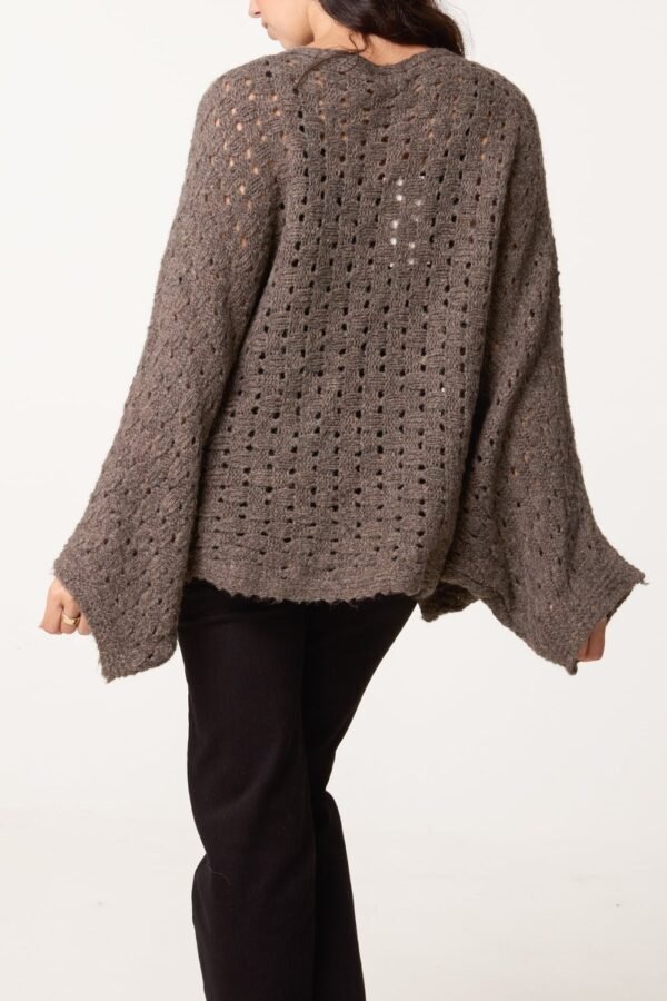 2026/09/1000492452.jpg Wrap Over Asymmetric Hem Knit Top