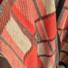 2026/09/JPEG_20260925_115148_3016841755443899585-scaled.jpg Orange/Chocolate Patterned Fringed Poncho